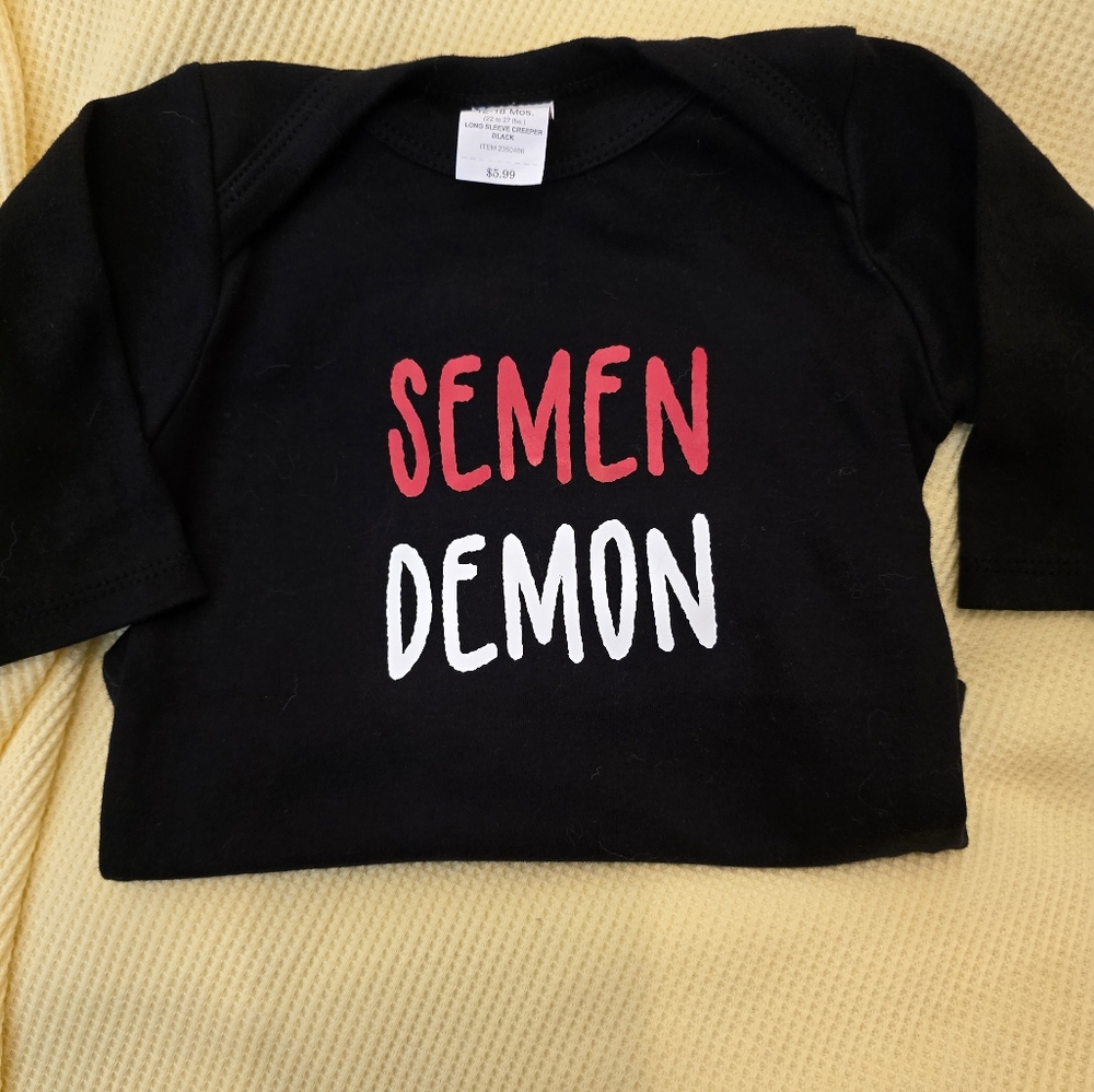 Hobby Lobby Black Baby Onesie with Red and White Text